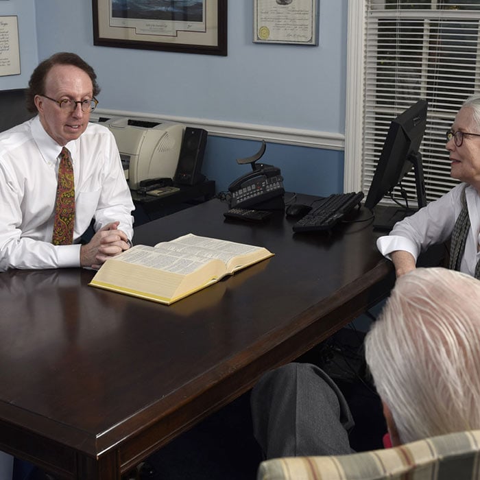 Jeffrey Scott Gartzman talking to clients
